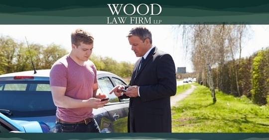 Men exchanging information after car crash